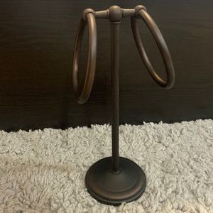 Brass hand towel holder.